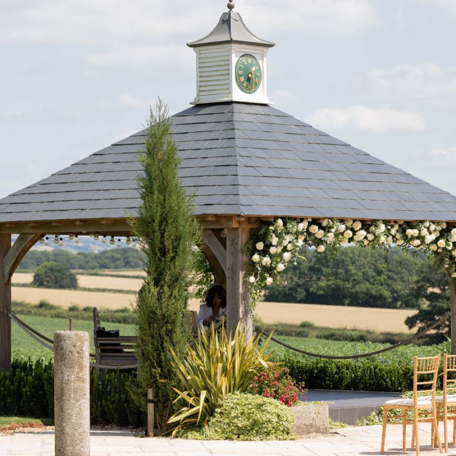 The Clock Tower with flowers at Harefield Barn wedding venue in Devon